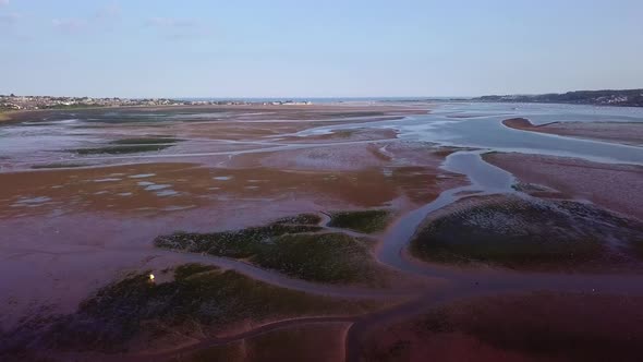 Red mud flats, dry river bed. Lympstone, England. Aerial view.