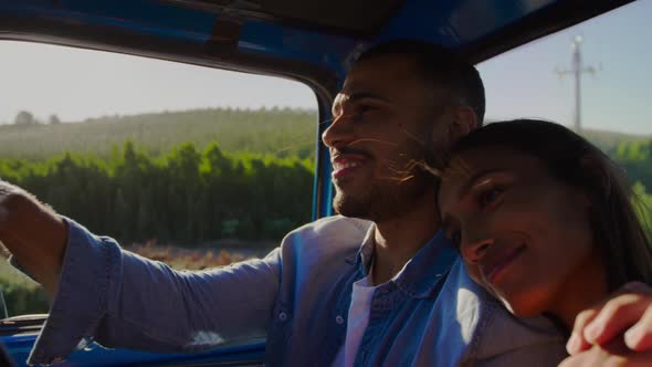 Young couple on a road trip in their pick-up truck