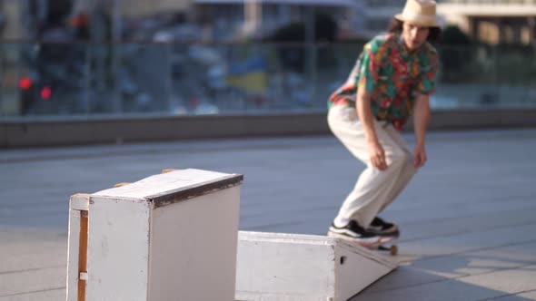 Active Skateboarder Sliding on Ledge Outdoors