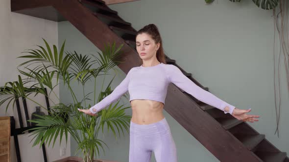 Young Woman Doing Gymnastics at Home