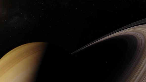 Orbiting around Saturn casting shadows on the rings