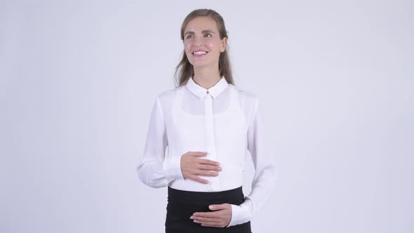 Young Happy Pregnant Businesswoman Thinking