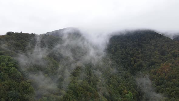 Fog in the Mountains. Aerial View of the Carpathian Mountains in Autumn. Ukraine