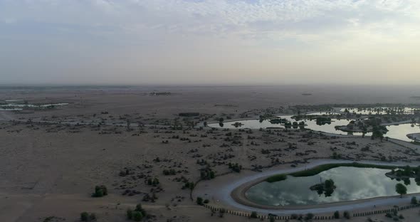 aerial of Al Qudra Lake in the desert near Dubai at sunrise RIGHT PAN