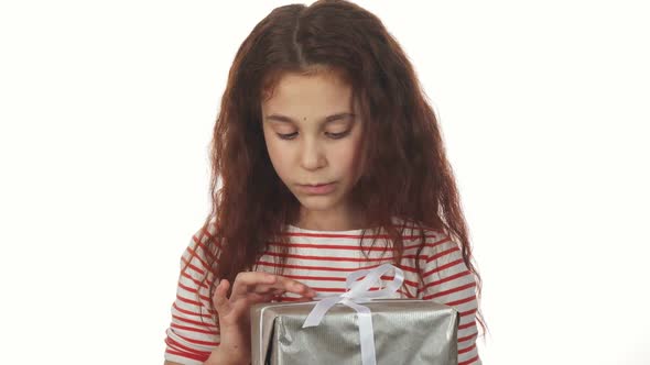 A Cunning Girl Unpacks Her New Year Gift