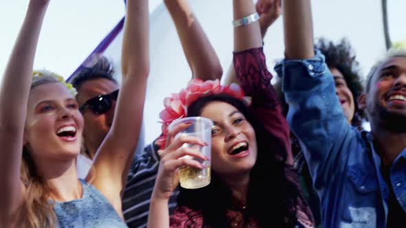 Group of friends having fun at music festival 4k