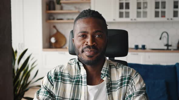 Close Up Portrait of Confident African American Man Sitting at Home Office and Smiling to Camera