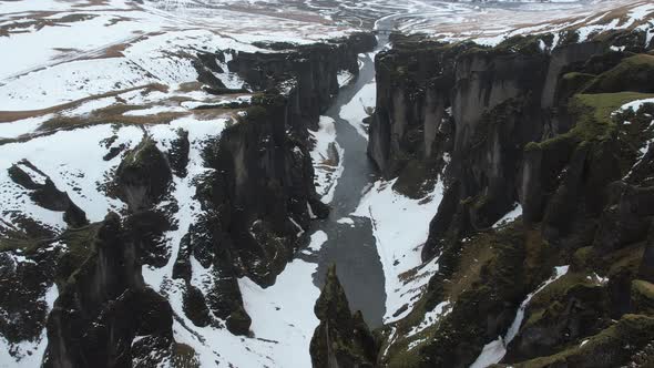 Aerial view of Fjardarargljufur canyon with river in wintertime, Iceland.