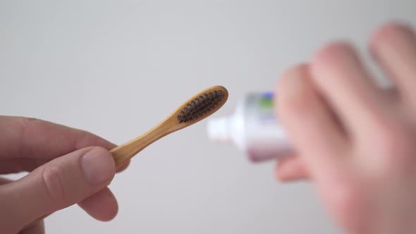 A Toothbrush With Toothpaste To Approach The Face