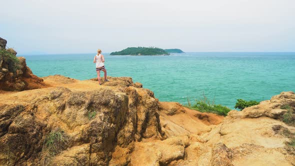 Woman Is Standing on The Shore of The Tropical Sea