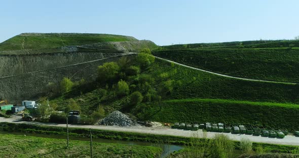 Aerial view of the side of a hill made of municipal waste.