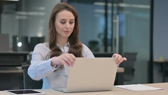 Young Woman Closing Laptop Standing up Going Away