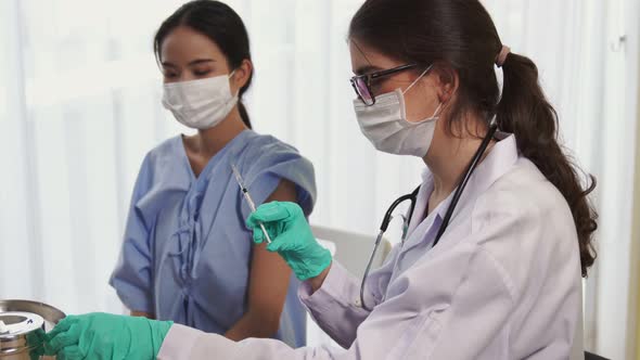 Young Woman Visits Skillful Doctor at Hospital for Vaccination