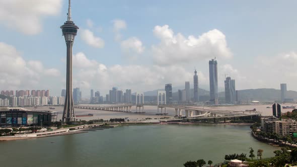 Macau Tower and Bridge Traffic Cityscape Timelapse Pan Up