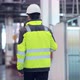 Shot of Professional Factory Worker Wearing Hard Hat Holds Tablet Computer Walking Thorugh Modern - VideoHive Item for Sale