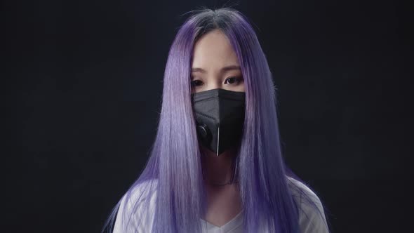 Young Asian Woman Removes the Protective Mask and Looking at the Camera Chinese Coronavirus Epidemic