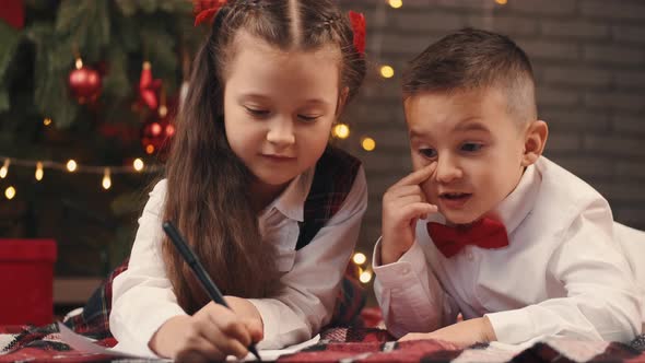 Kids Writing Letter To Santa on Christmas