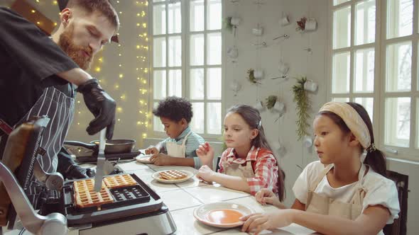 Chef Putting Waffles on Plates for Kids on Cooking Masterclass