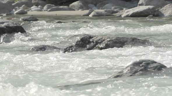 Closed frame in slowmotion of the water of the Venosc river in the French Alps. Pro Res