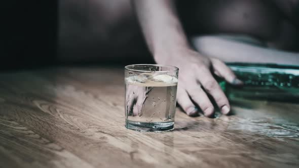 Alcoholic Falls to the Floor with Spilled Glass of Alcohol Overdose Slow Motion