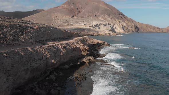 Aerial forward over Porto dos Frades coast on Porto Santo island, Madeira