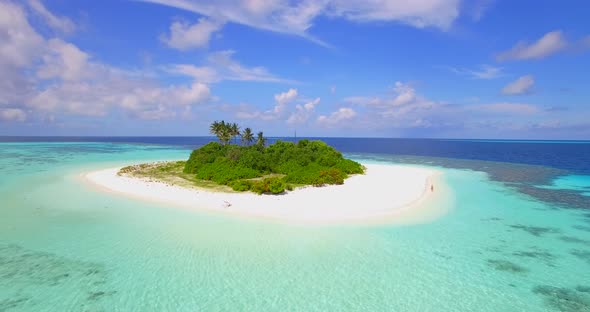 Aerial drone view of a scenic tropical island in the Maldives.