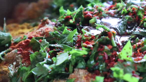 Colorful turkish dish spilled with liquid.Cooking oriental dolma with ingredients.Macro shot.