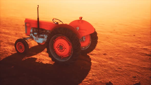 Vintage Retro Tractor on a Farm in Desert