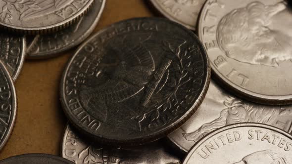 Rotating stock footage shot of American quarters (coin - $0.25) - MONEY 0229