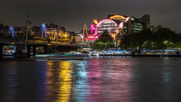 Night Illumination of Charing Cross station and Hungerford Bridge, London, UK.