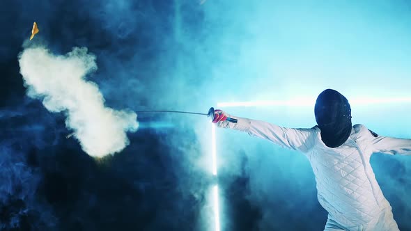 Male Fencer is Popping a Balloon in Slow Motion