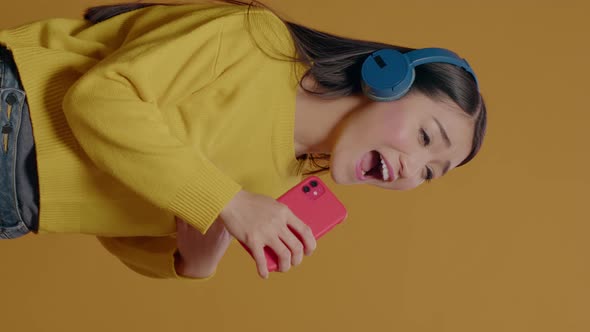 Vertical Video Person Using Smartphone As Microphone and Singing Song