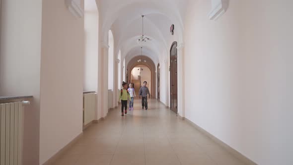 Schoolmates Walking Through Hallway