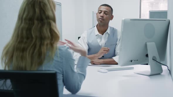 Business man and woman speaking