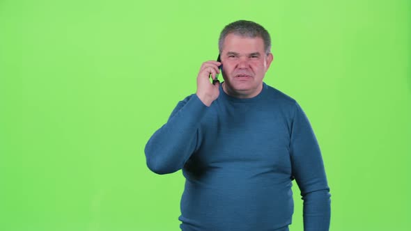 Man in the Age of Talking on the Phone. Green Screen