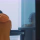 Young man looking out of window to foggy view - VideoHive Item for Sale
