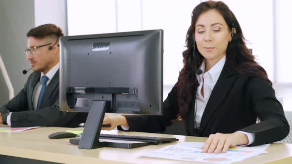 Business People Wearing Headset Working in Office