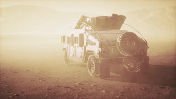 Military Patrol Car on Sunset in Desert Storm