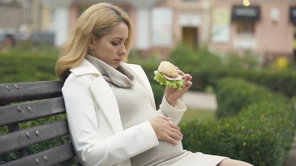 Mother-To-Be Eating Harmful Burger Sitting Park, High Fat Nutrition, Junk Food