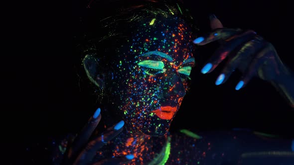Girl with Fluorescent Make-up, Body Art Design in UV, Painted Face, Colorful Make Up