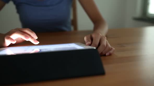 Woman working on tablet computer