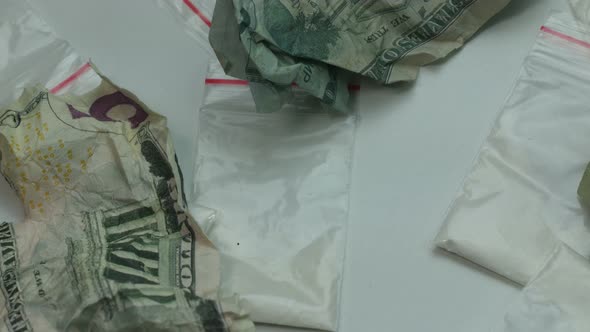 Portions of Cocaine and Crumpled Money