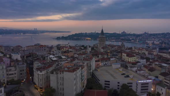 Galata Tower in Center of Istanbul Night To Day with Bosphorus and Istanbul Skyline, Aerial