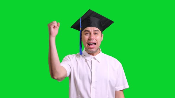 Young Male Graduate in Black Hat on Green Chroma Key Background