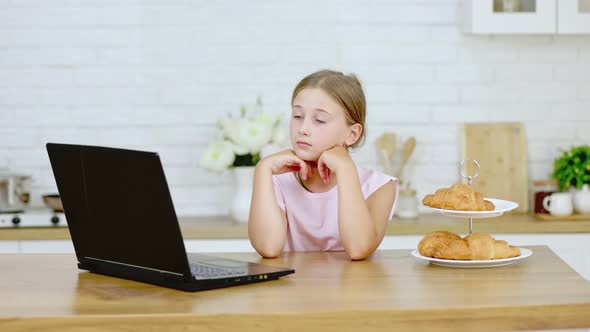 Girl Looking at Laptop