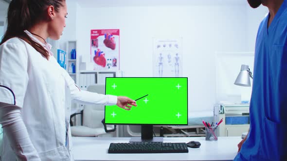 Doctor Explaining on Computer with Green Screen