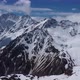 Flight above snowcapped mountains near Elbrus - VideoHive Item for Sale