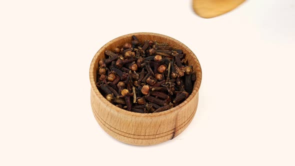 Chef Taking Chopped Dry Bud Flower of Clove Spices From Wooden Spice Jar