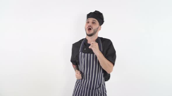 Happy Male Cook Dancing and Singing on White Background