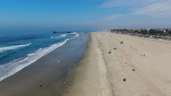 Aerial View of Huntington Pier, Beach and Coastline During Sunny Summer Day